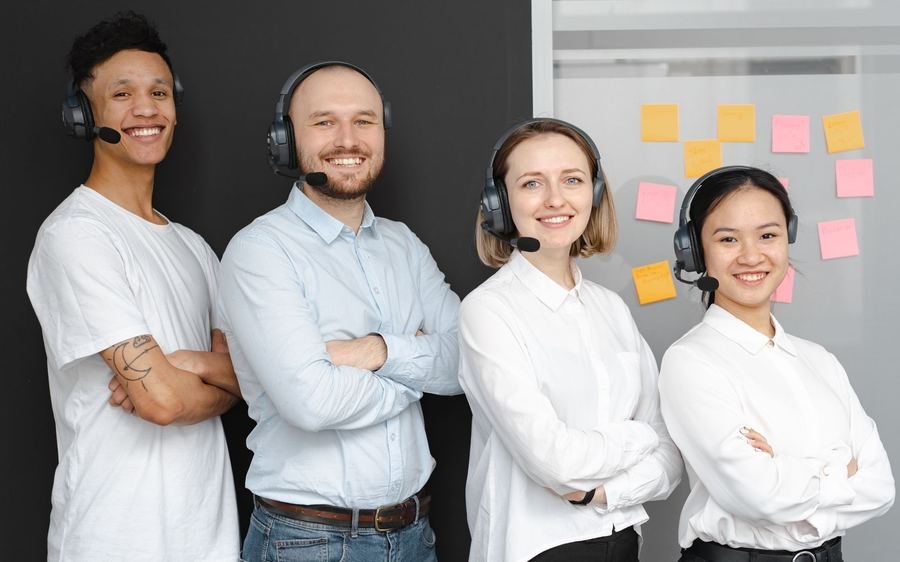 Friendly customer support team wearing headsets